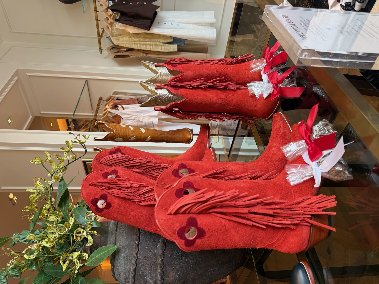 Ava Red Midi Cowgirl Boots on display at Veronica Beard